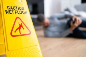 Caution floor sign placed to prevent slip and fall accidents