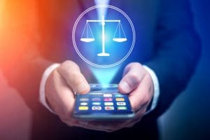 How Social Media Can Damage Your Alabama Personal Injury Claim - Blackwell Law Firm Man holding a phone in his hands